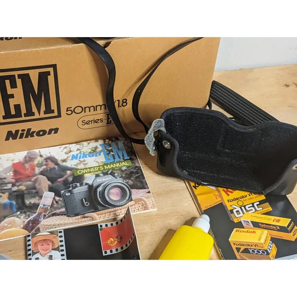 Nikon EM Black body 50mm Series E + Auto Tele Converter + Bag + Kalimar Light +